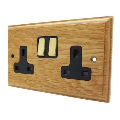 Jacobean Light Oak Polished Brass Switched Plug Socket Sockets