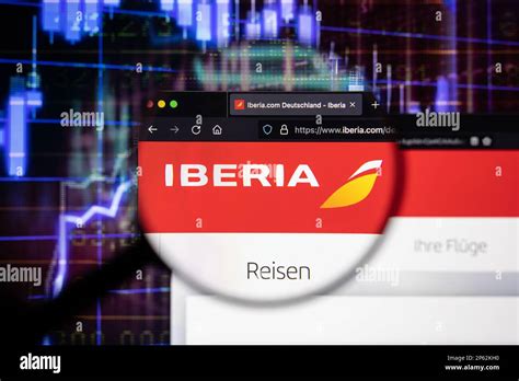 Iberia Airline Company Logo On A Website With Blurry Stock Market