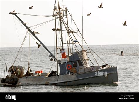 Small Commercial Fishing Boat Trolling On Ocean Stock Photo Alamy