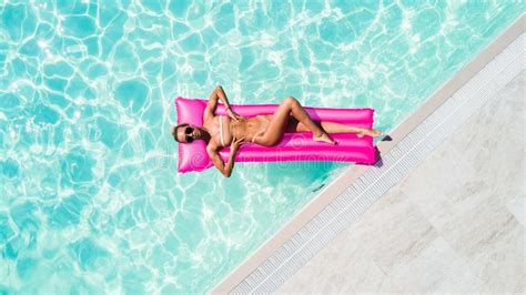 Summer Vacation Enjoying Suntan Woman In Bikini On The Inflatable