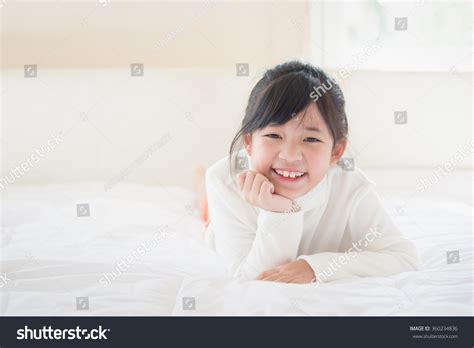 Happy Asian Girl Lying On Bed库存照片360234836 Shutterstock