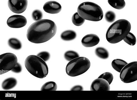 Falling Black Olive Isolated On White Background Selective Focus Stock