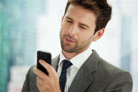 Businessman Sending Text Message On Cell Phone Stock Photo Dissolve