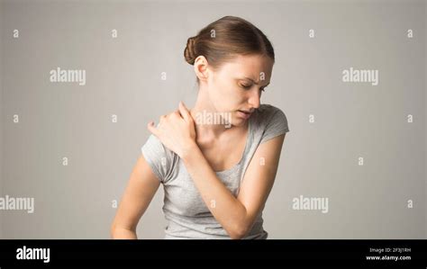 Tired Woman Feeling Neck Pain Massaging Tense Muscles Stock Photo Alamy