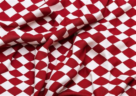 Premium Photo A Red And White Checkered Fabric With A White Square