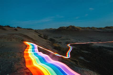 Long Exposure Photography Of Rainbow Road Illuminated Landscapes