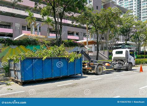 Garbage Container Latch With Truck Full Of Garden Refuse Woods Stock