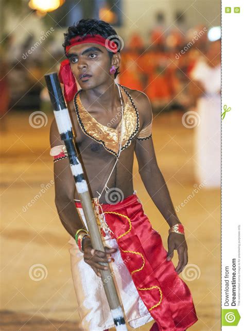 A Colourfully Dressed Stick Dancer Performs In The Kataragama Festival