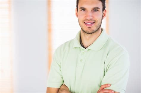 Premium Photo Portrait Of Smiling Handsome Masseur With Arms Crossed