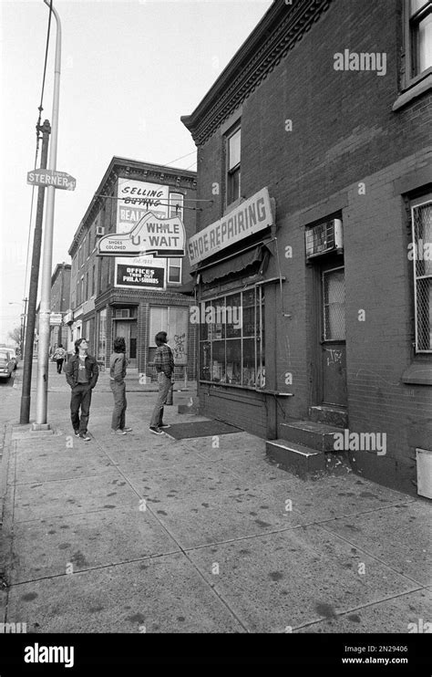 Three neighborhood boys look at Joseph Kallinger's shoe repair shop in ...