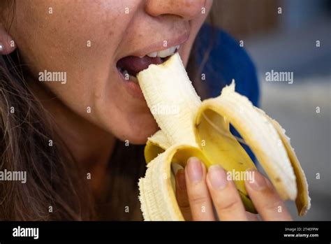 Woman Eats Food Woman Eats Banana Close Shot Of Girl Eating Bananas Face While Eating Banana