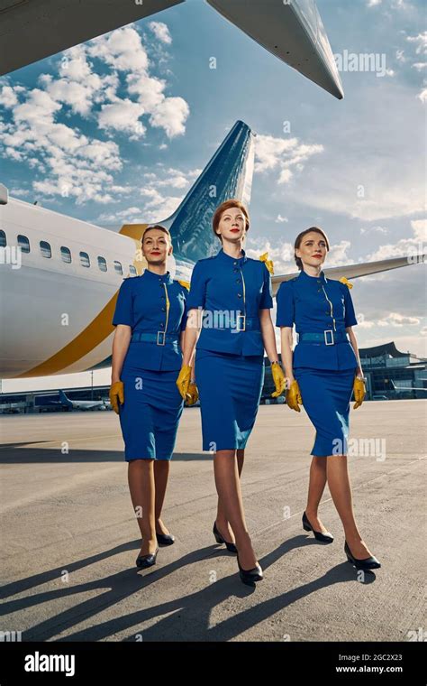 Group Of Charming Air Hostesses Posing For The Camera Stock Photo Alamy