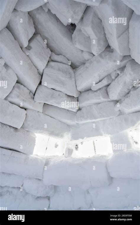 An Inside View Of A Wall Of Snow Bricks And A Window Made Of Ice In An