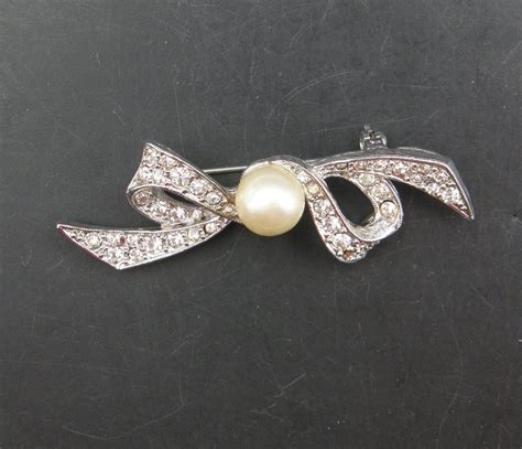 124:: 1930s Marvella Brooch or Pin, center pearl on a Rhinestones ribbon bow - Mark C. Grove