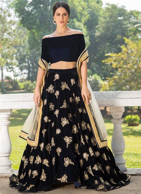 Navy Blue And Gold Off Shoulder Velvet Lehenga Features A Navy Blue Velvet Blouse Embroidered