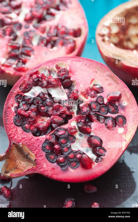 Fresh Juicy Pomegranate Fruit With Seeds Close Up Stock Photo Alamy