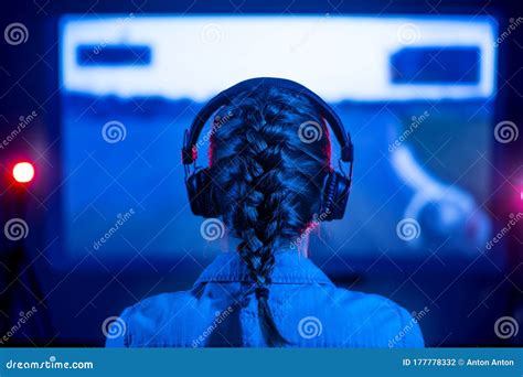 Gamer Plays A Video Game On A Tv Or Pc Screen Girl In A Neon Room At