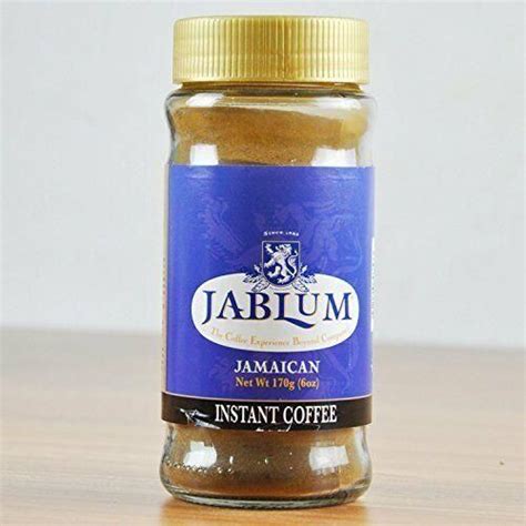 Jar Of Jablum Jam On Wooden Table With White Wall In Backgroud