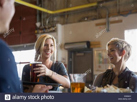 woman serving pint beer  res stock photography  images alamy