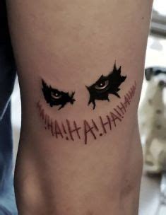 A Close Up Of A Person S Leg With A Tattoo That Says Batman