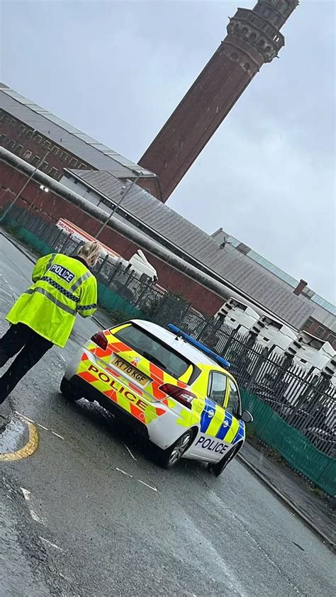 Inmate pictured on the roof of 'Strangeways' UK prison after climbing up