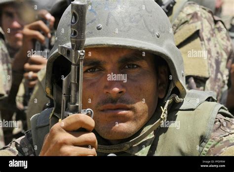 An Afghan National Army Territorial Force Member Watches Security