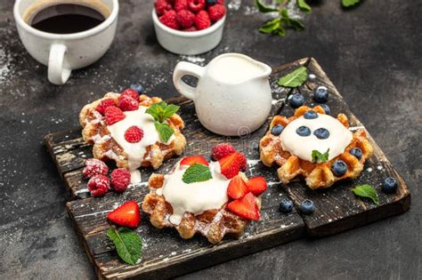 Belgian Waffles With Raspberries Strawberries And Blueberries Sugar