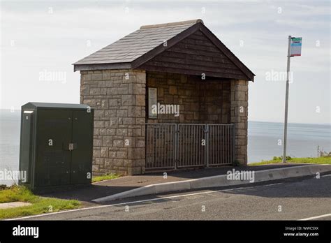 Small Gated Roadside Bus Shelter Made From Local Stone And Solidly