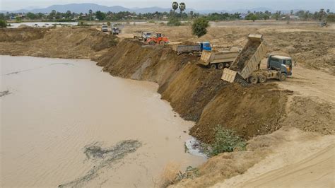 Strange Activity Team Dump Truck Transport Soil Filling Big Pond With