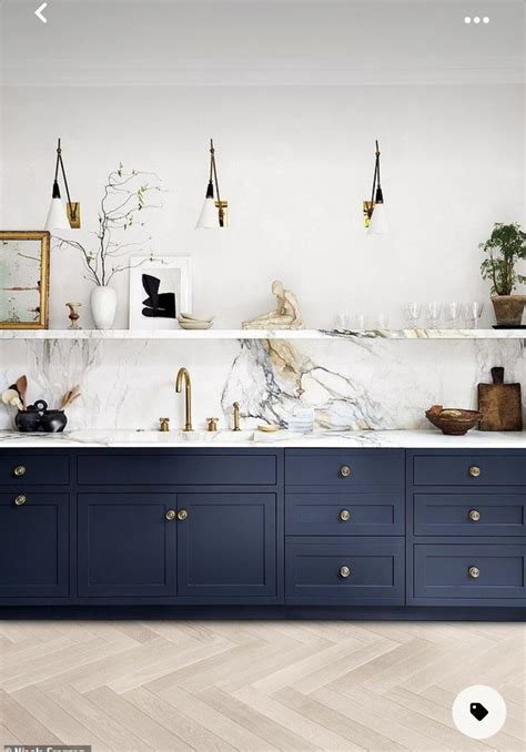 The Instagram Page Shows An Image Of A Kitchen With Blue Cabinets And