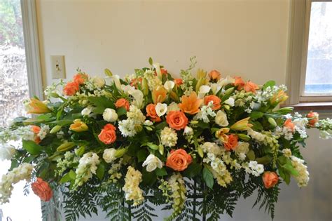 MSB135 Orange And White Casket Spray By PF Designs