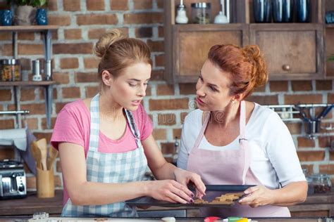 Mother And Daughter Making Cookies Stock Image Image Of Emotions