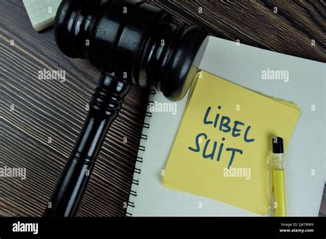 Concept Of Libel Suit Write On Sticky Notes With Gavel Isolated On