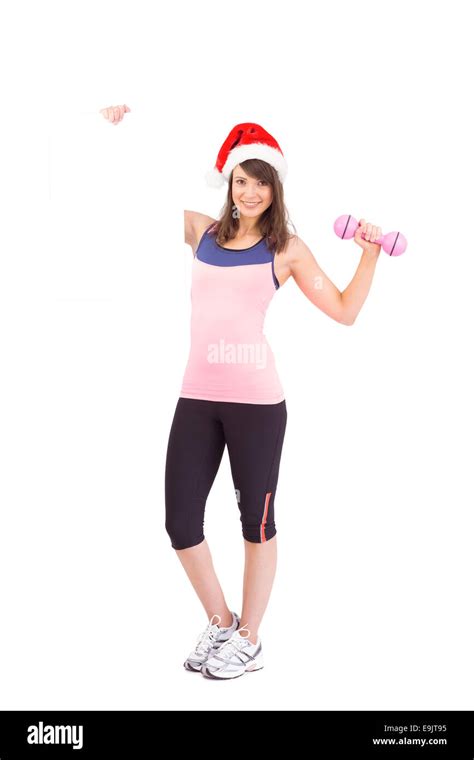 Festive Fit Brunette Smiling At Camera Holding Poster Stock Photo Alamy