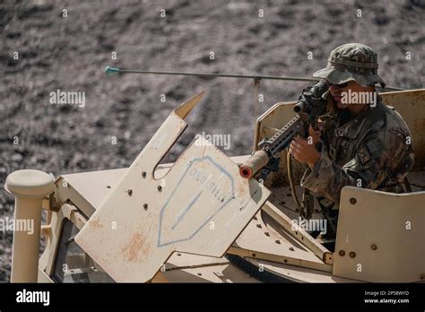 A Us Army Soldier Assigned To Task Force Wolfhound Aims A Weapon At