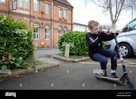 Boy Doing Tricks On A Stunt Scooter Stock Photo Alamy