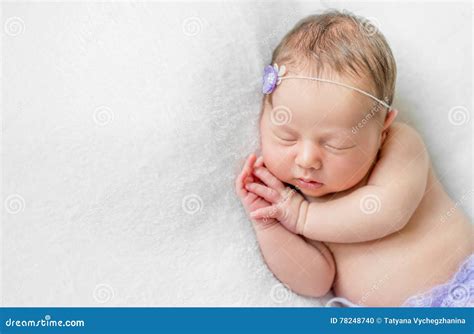 Lovely Newborn Girl Sleeping With Hands Under Head Top View Stock