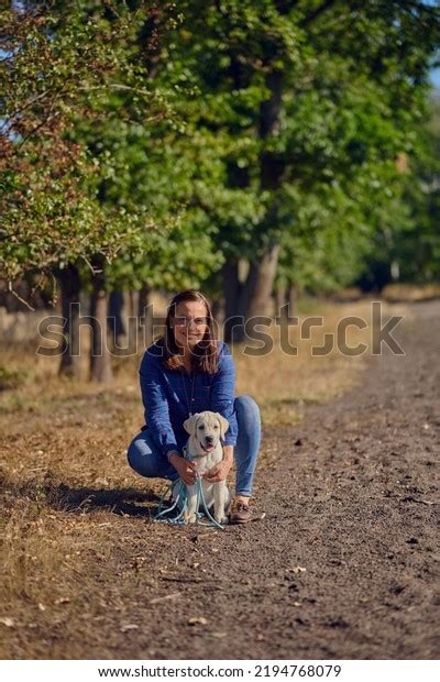 Happy Brunette Middleaged Woman Kneeing Her Stock Photo 2194768079
