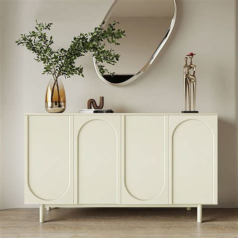 A White Cabinet With A Mirror And Vases On It In Front Of A Wall