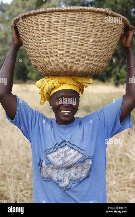 African Woman Carrying Basket On Head