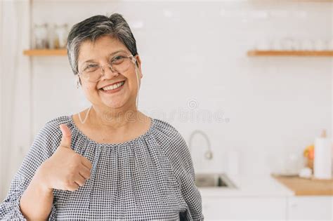 Portrait Happy Healthy Mature Asian Woman Smiling Cute Lovely At Home