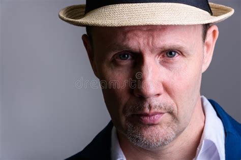 Close Up Of Mature Businessman Wearing Hat Indoors Stock Photo Image