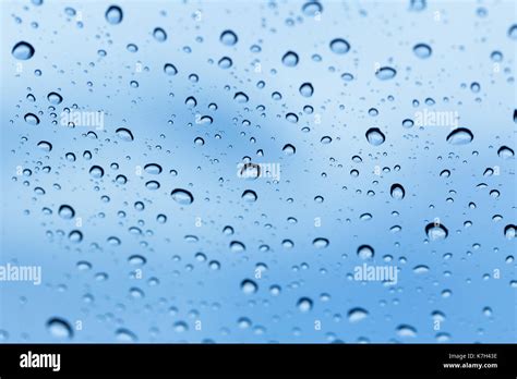 rain water drops with blur blue sky background Stock Photo - Alamy