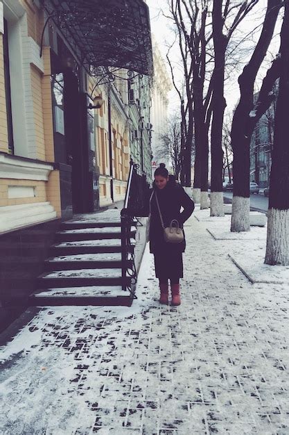 Premium Photo Front View Of Person Walking On Snow Covered Sidewalk