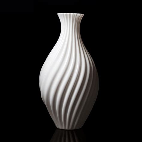 Premium Photo A White Vase With Wavy Lines