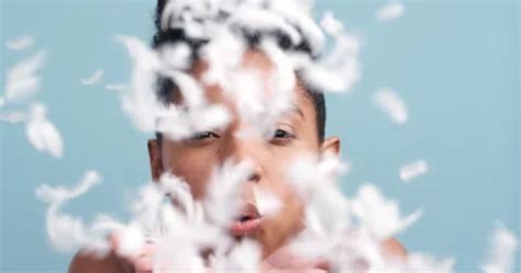 Woman In Nude Blow Feather From Hand Wi Stock Video Pond5