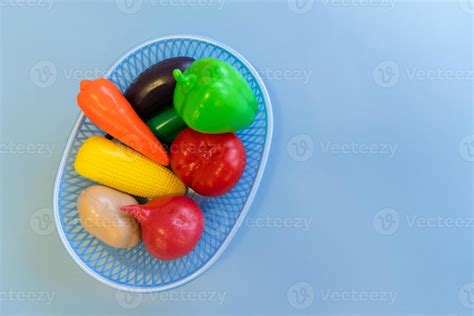 plastic fruit in a basket on a blue background 5742455 Stock Photo at ...