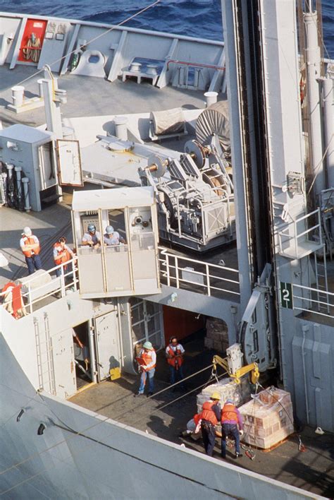 Crew Members Aboard The Combat Stores Ship USNS SPICA T AFS 9 Prepare