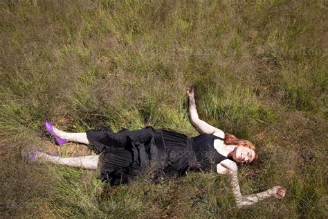 Girl lying in Grass 17404620 Stock Photo at Vecteezy