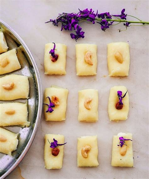 Several Pieces Of Food Sitting On Top Of A Table Next To A Pan Filled With Purple Flowers